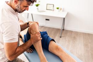 Provider working on patient's knee